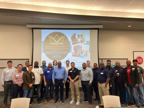 Male mentors posing un front of conference room