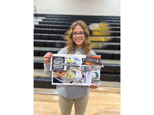 female students showing her vision board poster