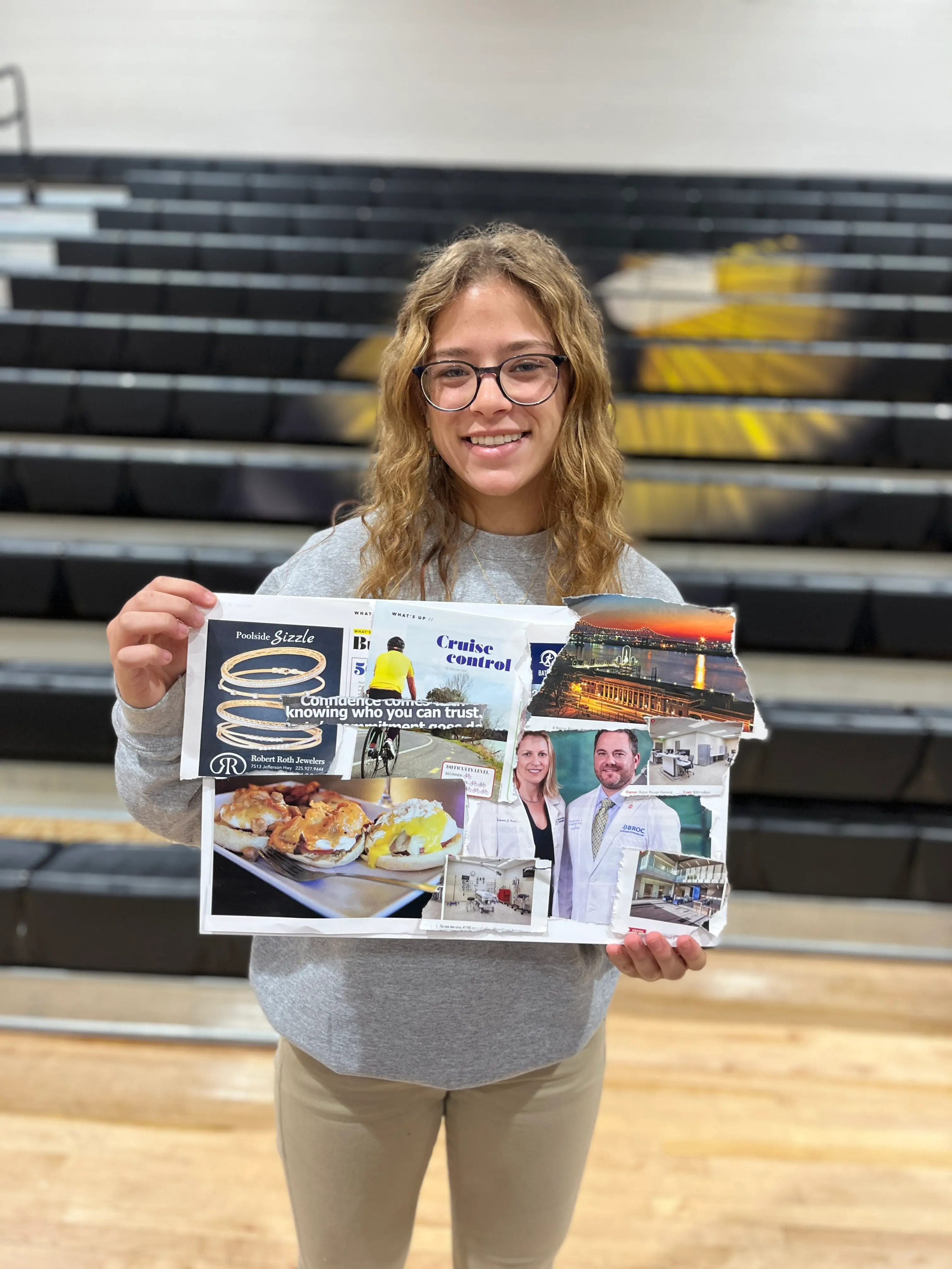 female students showing her vision board poster