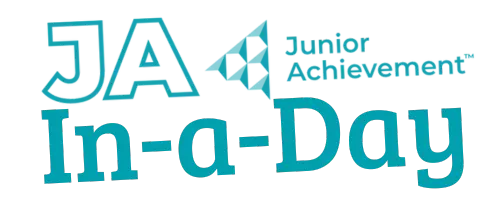 Female Volunteer posing with 8 students in classroom